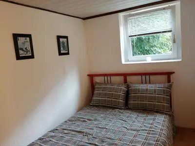 Ein Bett oder Betten in einem Zimmer der Unterkunft Haus Königstein FeWo Bielablick