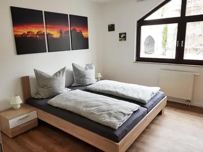 Ein Bett oder Betten in einem Zimmer der Unterkunft Ferienwohnung Schlosswächter am Schloss Colditz