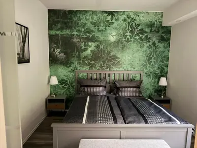 Ein Bett oder Betten in einem Zimmer der Unterkunft Ferienwohnung Heinzebank