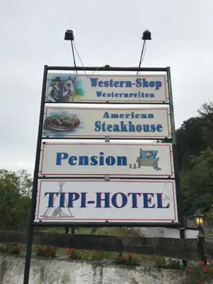 Ein Zertifikat, Auszeichnung, Logo oder anderes Dokument, das in der Unterkunft Western-Inn ausgestellt ist