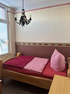 Ein Bett oder Betten in einem Zimmer der Unterkunft Western-Inn