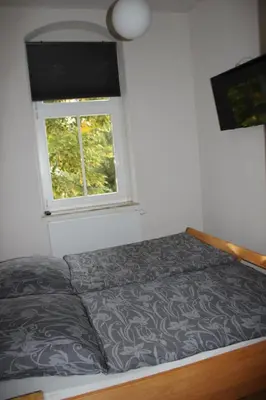 Ein Bett oder Betten in einem Zimmer der Unterkunft Ferienwohnung Goldgrund15