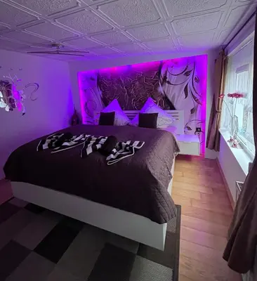 Ein Bett oder Betten in einem Zimmer der Unterkunft Ferienwohnung Heyne
