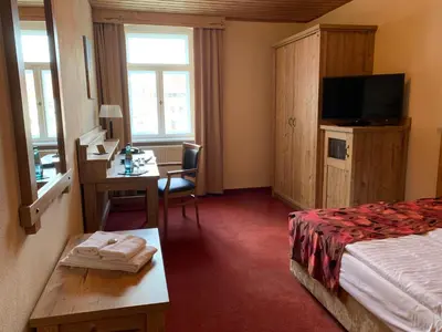 Ein Bett oder Betten in einem Zimmer der Unterkunft Hotel Goldner Löwe