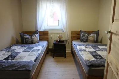 Ein Bett oder Betten in einem Zimmer der Unterkunft Ferienwohnungen Kleiner Kuhstall