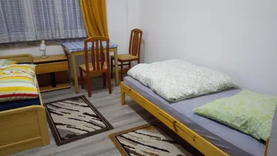 Ein Bett oder Betten in einem Zimmer der Unterkunft LINDENHOF WALDHEIM