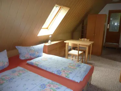 Ein Bett oder Betten in einem Zimmer der Unterkunft Gästehaus Gauernitzer Hof