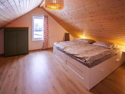 Ein Bett oder Betten in einem Zimmer der Unterkunft Ferienhaus am Partwitzer See, Elsterheide