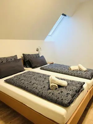 Ein Bett oder Betten in einem Zimmer der Unterkunft Pension Maria