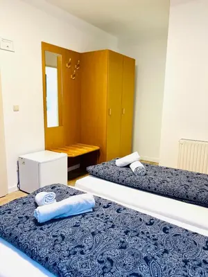 Ein Bett oder Betten in einem Zimmer der Unterkunft Pension Maria
