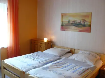Ein Bett oder Betten in einem Zimmer der Unterkunft Ferienwohnungen Markgraf