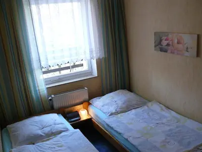 Ein Bett oder Betten in einem Zimmer der Unterkunft Ferienwohnungen Markgraf