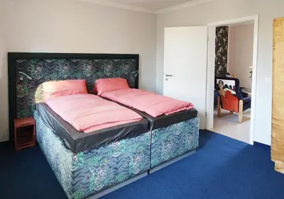 Ein Bett oder Betten in einem Zimmer der Unterkunft Alte Sattlerei- Wohnen mit besonderem Flair
