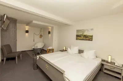 Ein Bett oder Betten in einem Zimmer der Unterkunft Burghotel Stolpen