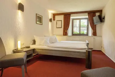 Ein Bett oder Betten in einem Zimmer der Unterkunft Burghotel Stolpen