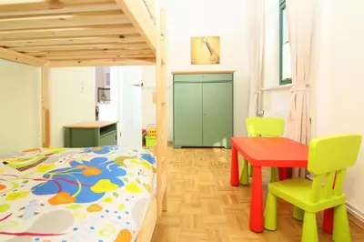 Ein Bett oder Betten in einem Zimmer der Unterkunft Kaitzbach-Idylle