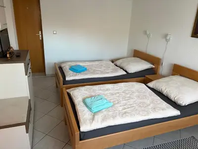 Ein Bett oder Betten in einem Zimmer der Unterkunft Zimmervermietung Lippmann