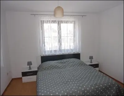 Ein Bett oder Betten in einem Zimmer der Unterkunft Ferienwohnung Kohrener Land