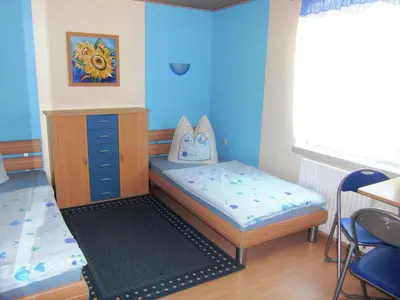 Ein Bett oder Betten in einem Zimmer der Unterkunft Lichtenhain Family Fun