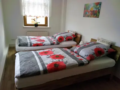 Ein Bett oder Betten in einem Zimmer der Unterkunft Ferienwohnung Familie Schneider