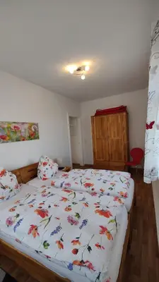 Ein Bett oder Betten in einem Zimmer der Unterkunft Ferienwohnung Familie Schneider