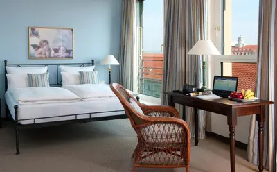 Ein Bett oder Betten in einem Zimmer der Unterkunft Hotel Elbflorenz Dresden