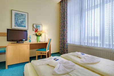 Ein Bett oder Betten in einem Zimmer der Unterkunft Hotel Alte Klavierfabrik Meißen