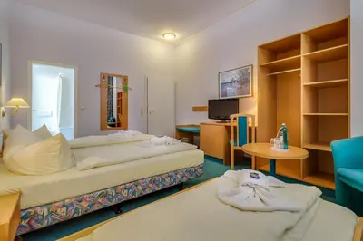 Ein Bett oder Betten in einem Zimmer der Unterkunft Hotel Alte Klavierfabrik Meißen