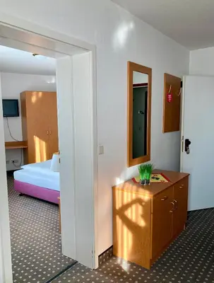 Ein Bett oder Betten in einem Zimmer der Unterkunft Akzent Congresshotel Hoyerswerda