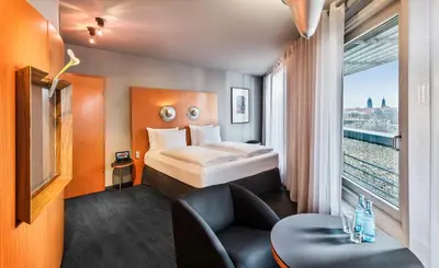 Ein Bett oder Betten in einem Zimmer der Unterkunft Penck Hotel Dresden