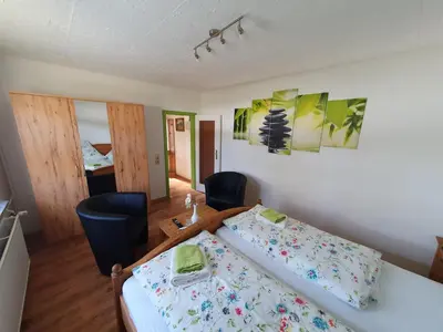 Ein Bett oder Betten in einem Zimmer der Unterkunft Ferienwohnung Hartmann