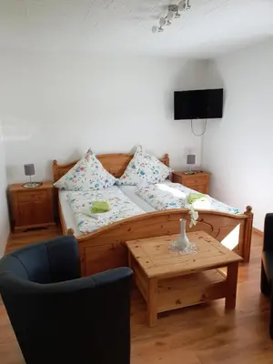 Ein Bett oder Betten in einem Zimmer der Unterkunft Ferienwohnung Hartmann