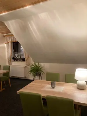 Ein Sitzbereich in der Unterkunft Pension Haufe