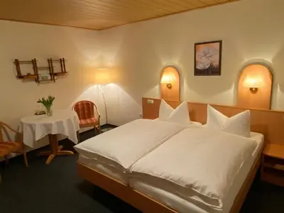 Ein Bett oder Betten in einem Zimmer der Unterkunft Pension Haufe