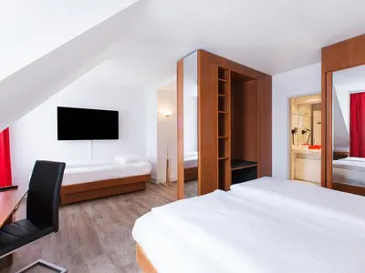 Ein Bett oder Betten in einem Zimmer der Unterkunft DORMERO Hotel Dresden Airport