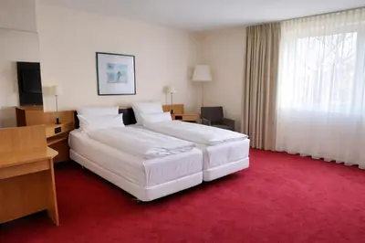 Ein Bett oder Betten in einem Zimmer der Unterkunft Hotel Dresden Neustadt