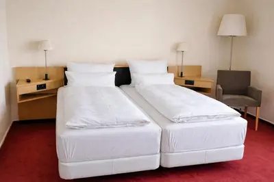 Ein Bett oder Betten in einem Zimmer der Unterkunft Hotel Dresden Neustadt