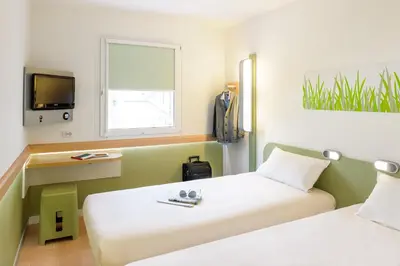Ein Bett oder Betten in einem Zimmer der Unterkunft ibis budget Dresden Kesselsdorf