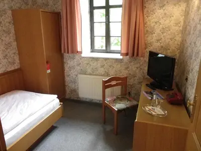 Ein Bett oder Betten in einem Zimmer der Unterkunft Hotel Wenzels Hof