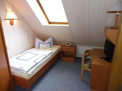 Ein Bett oder Betten in einem Zimmer der Unterkunft Hotel Wenzels Hof