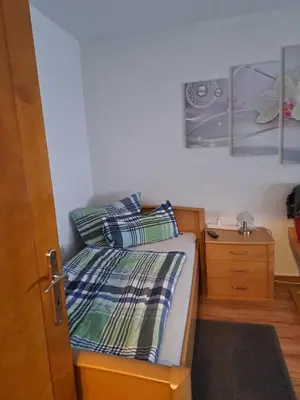 Ein Bett oder Betten in einem Zimmer der Unterkunft Monteur- und Ferienwohnung in Hainichen OT Bockendorf - Erdgeschosswohnung - Familie Weber