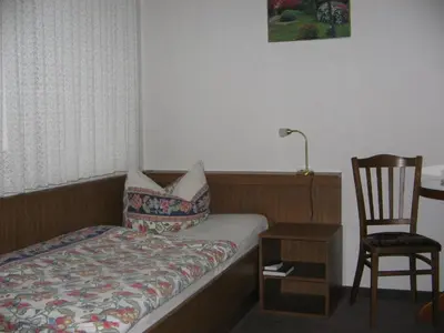 Ein Bett oder Betten in einem Zimmer der Unterkunft Pension 