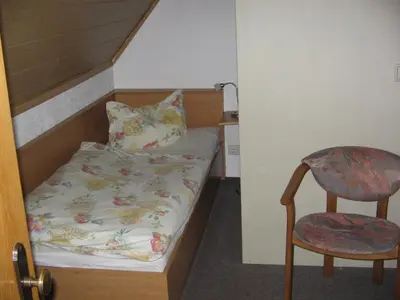 Ein Bett oder Betten in einem Zimmer der Unterkunft Pension 