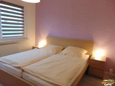 Ein Bett oder Betten in einem Zimmer der Unterkunft Ferienwohnung 