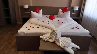 Ein Bett oder Betten in einem Zimmer der Unterkunft Hotel Am Obermarkt
