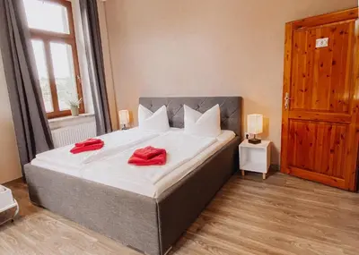 Ein Bett oder Betten in einem Zimmer der Unterkunft Hotel Am Rittergut