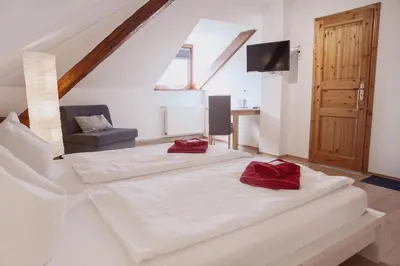 Ein Bett oder Betten in einem Zimmer der Unterkunft Hotel Am Rittergut