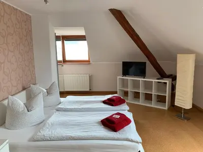 Ein Bett oder Betten in einem Zimmer der Unterkunft Hotel Am Rittergut