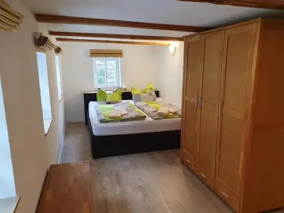 Ein Bett oder Betten in einem Zimmer der Unterkunft Ferienhaus Bildhauer Thiele