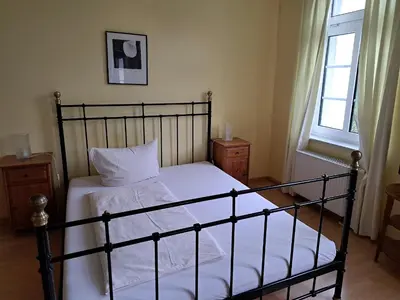 Ein Bett oder Betten in einem Zimmer der Unterkunft Gästehaus Villa Seraphinum